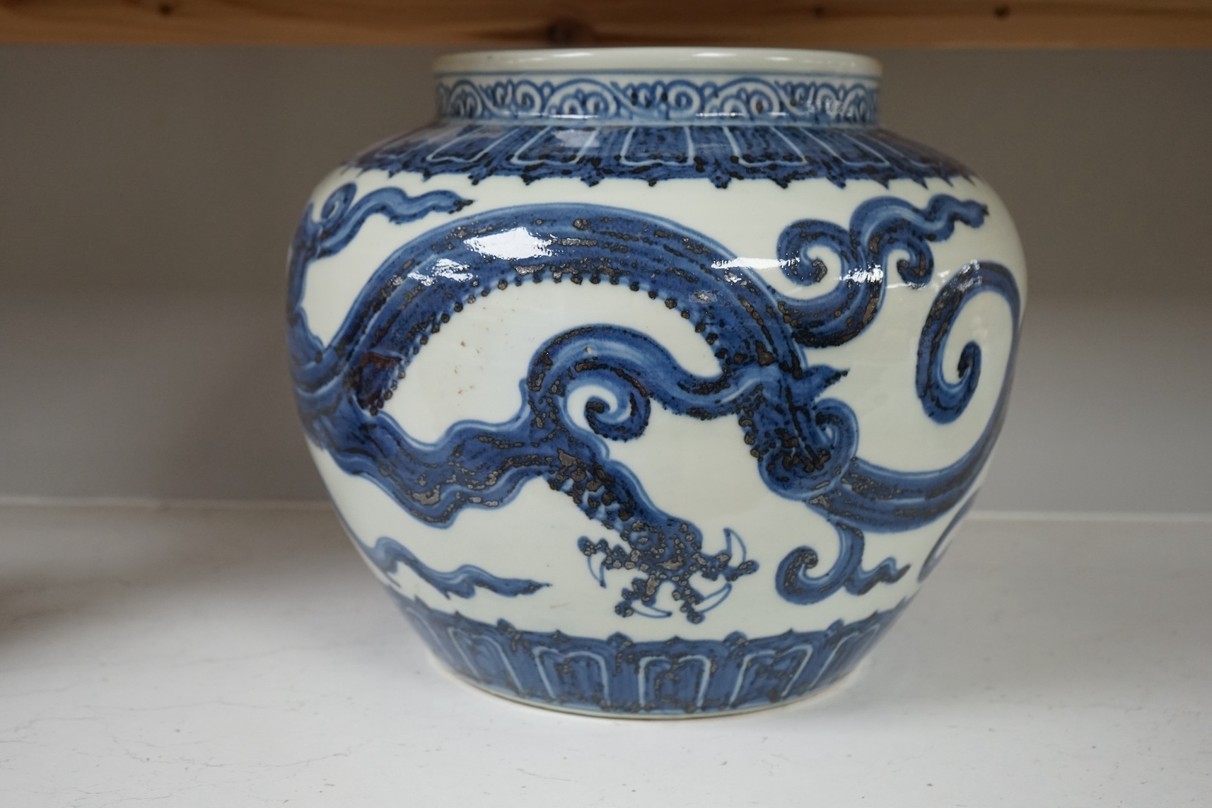 A Chinese large blue and white ‘dragon’ jar, 29cm. Condition - good